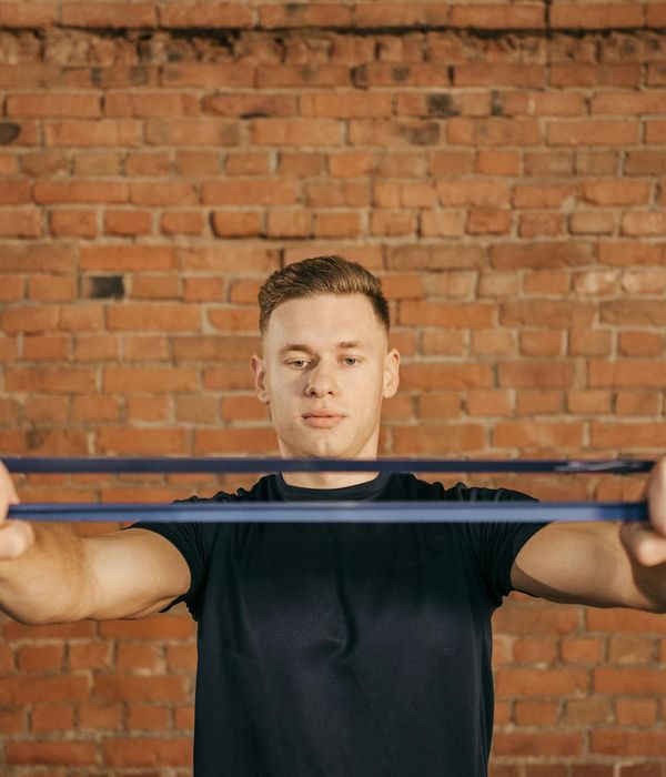 Man performing gentle strength exercises at home
