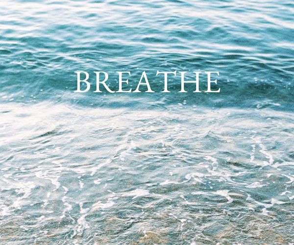 Man standing confidently and breathing deeply